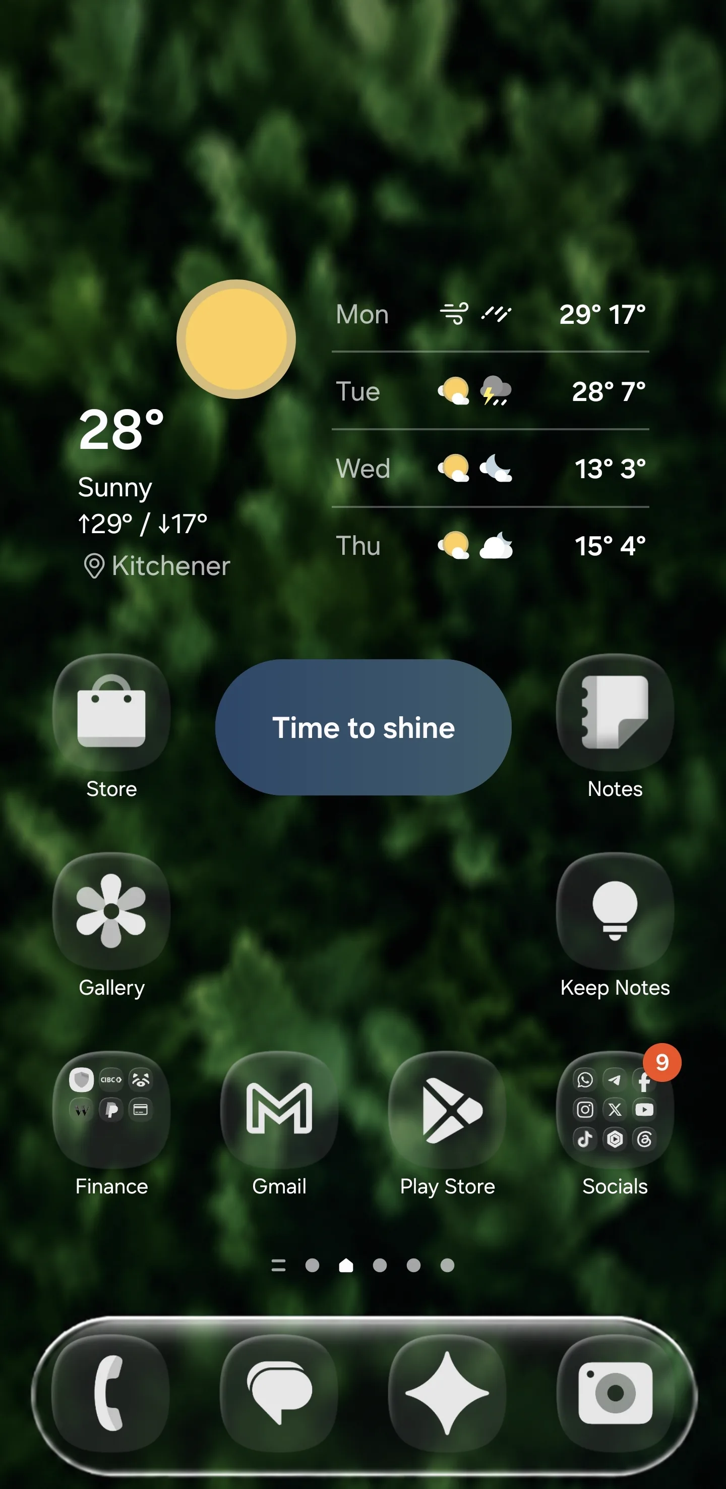 Finished glass icon home screen setup with blurred green wallpaper and glass dock