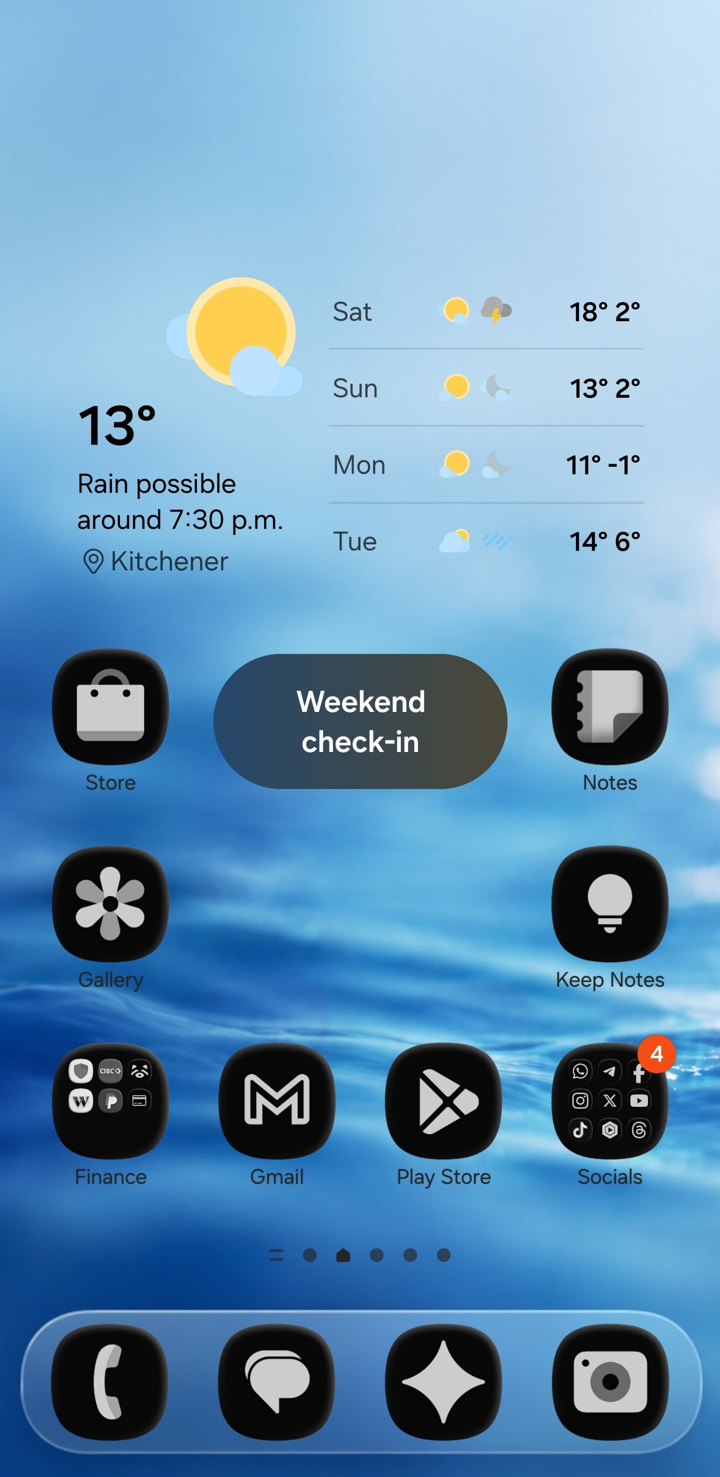 Samsung One UI home screen with black and white icons, blue dock wallpaper, and weather widget
